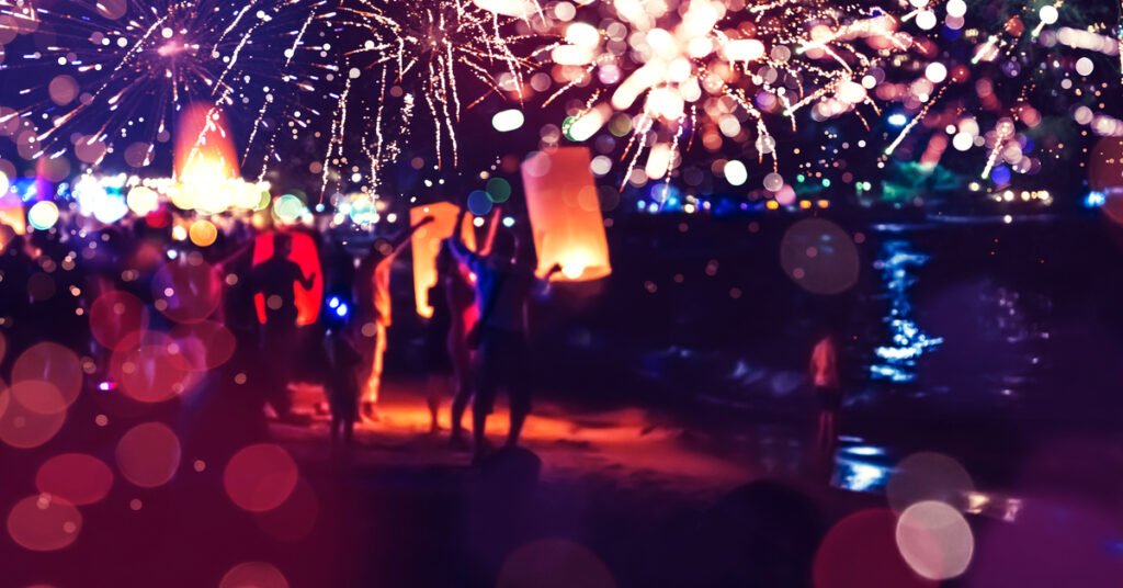 People Celebrate New Year. Fireworks circle blur. Colorful in celebration. Thailand Beach