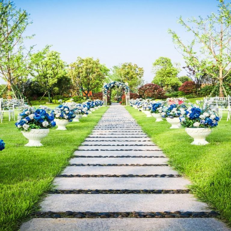 Beautiful wedding flower arrangement of seats along the aisle