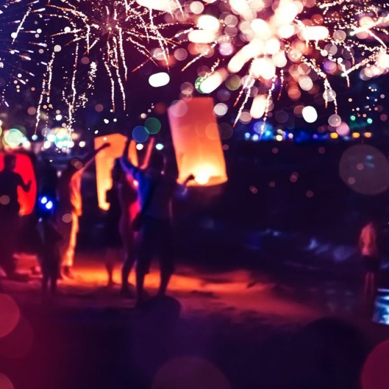 People Celebrate New Year. Fireworks circle blur. Colorful in celebration. Thailand Beach